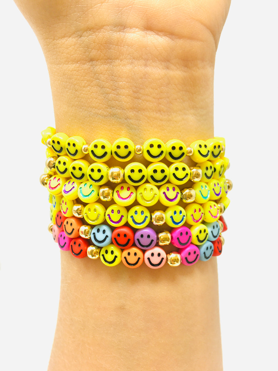 PULSERA CARITA FELIZ BOLITA DORADA